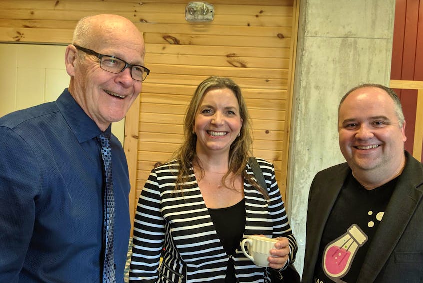 
Kings County Warden Peter Muttart, Rachel Brown of the Atlantic Canada Opportunities Agency and entrepreneurial support businessman Andrew Button chat after a federal plan to expand high-speed internet access was unveiled at Ross Farm Museum in New Ross on Thursday. 

