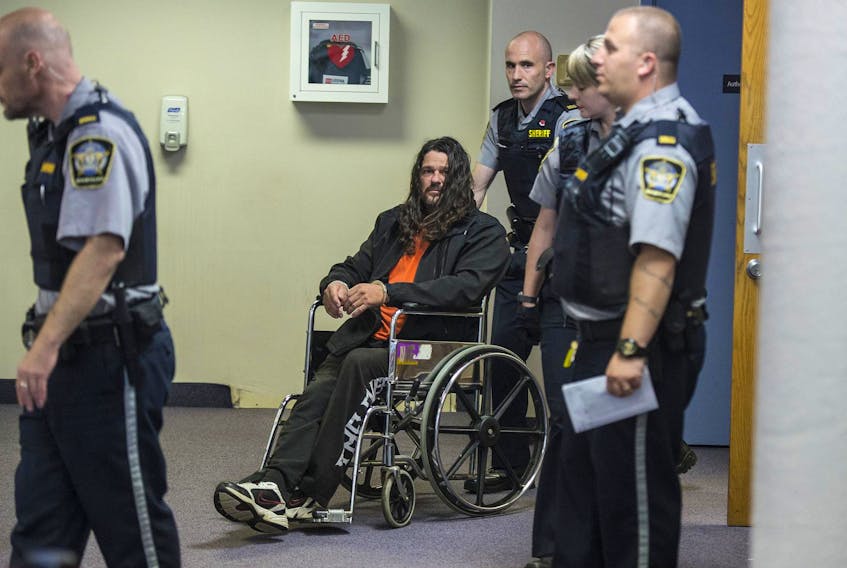 Ontario Hells Angels member Mark David Heickert is wheeled out of Dartmouth provincial court in November 2017 after his arraignment on drug conspiracy charges. – Ryan Taplin
