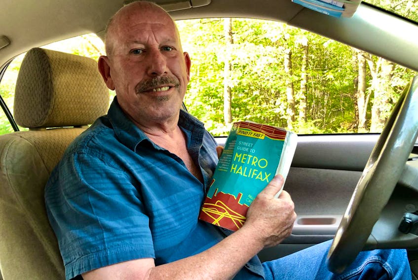 
Halifax cab driver Donald Roach finds unfamiliar locations the old-fashioned way, with a comprehensive street guide that hasn’t failed him yet.

