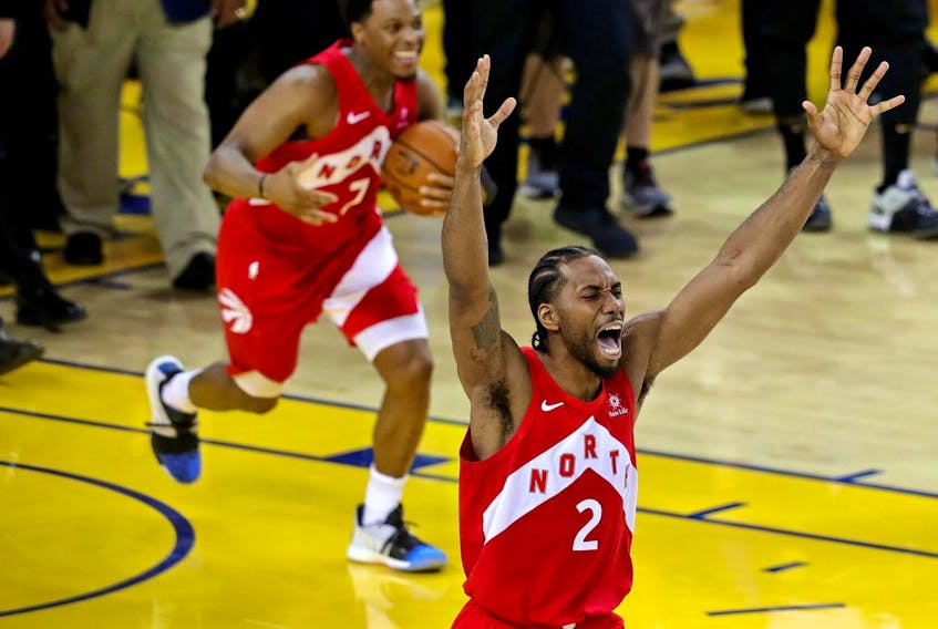 
Toronto Raptors forward Kawhi Leonard (2) and guard Kyle Lowry celebrate winning the NBA championship over the Golden State Warriors in Game 6 of the final on June 13 in Oakland, Calif. - Sergio Estrada / USA TODAY Sports
