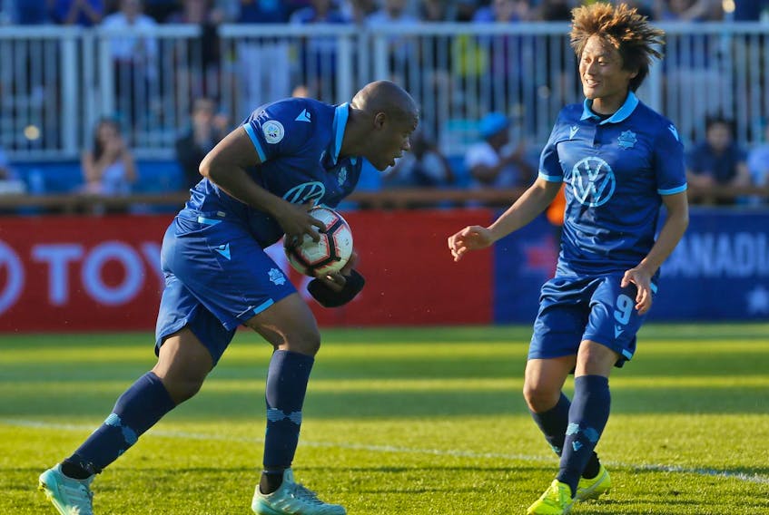 
Halifax Wanderers’ Luis Perea runs off with the ball after scoring the team’s first goal on a penalty kick as teammate Kodai Iida celebrates. The Wanderers lost 3-2 to the Ottawa Fury in the first leg of the third round of the Canadian Championship at the Wanderers Grounds on Wednesday. - TIM KROCHAK / The Chronicle Herald
