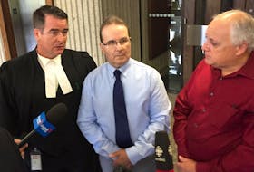 
Glen Assoun, centre, is shown with his lawyer Sean MacDonald, left, and Ron Dalton, co-founder of Innocence Canada outside of court in Halifax on July 12, 2019. - Andrew Rankin
