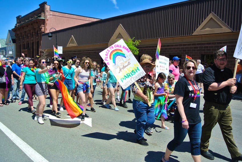 Rev. Will Ferrey, rector of Christ Church in Amherst, and members of his congregation march in Amherst’s Pride parade in June. Ferrey said he and his congregation are disappointed with the Anglican Church of Canada’s vote not to change its marriage canon to allow same-sex marriages.