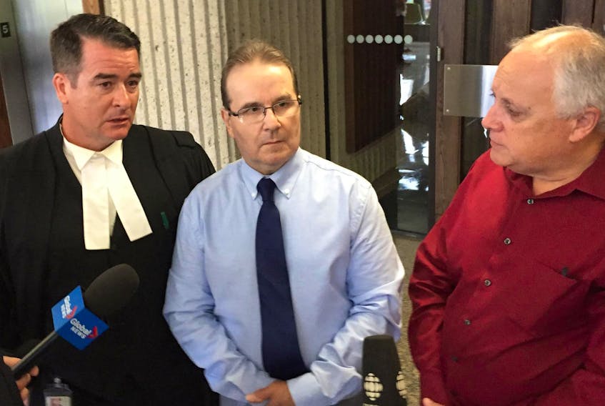 
Glen Assoun, centre, his lawyer Sean MacDonald, left, and Ron Dalton, co-founder of Innocence Canada, discuss the release of hundreds of documents in Assoun’s wrongful murder conviction case Friday. - Andrew Rankin
