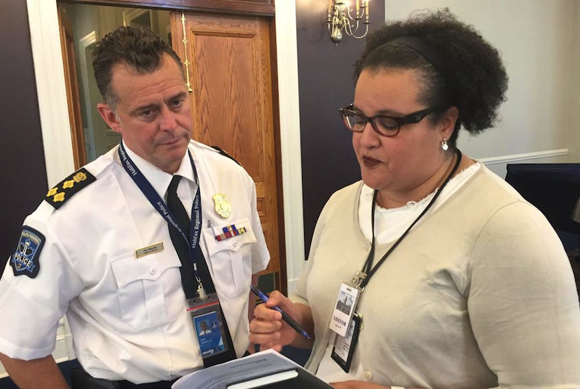 
Halifax Police Chief Dan Kinsella and Natalie Borden, chairwoman of the Halifax police commission, confer at Wednesday’s commission meeting at city hall. - Francis Campbell
