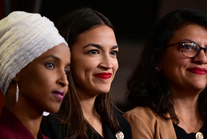 
U.S. congresswomen Ilhan Omar, Alexandria Ocasio-Cortez and Rashida Tlaib, hold a news conference after Democrats in the U.S. Congress moved to formally condemn President Donald Trump’s attacks on four minority representatives on Capitol Hill in Washington, U.S., on Monday. 
