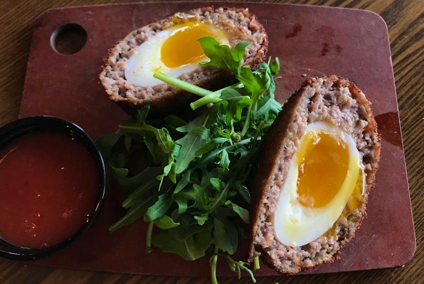 
The Scotch egg was expertly cooked with breaded sage-seasoned sausage cooked golden and crisp on the outside, and the egg cooked to a creamy runniness on the inside. - Kelly Neil
