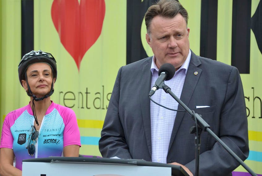 
 Rafah DiCostanzo, MLA for Clayton Park West, looks on as Mayor Mike Savage makes an announcement about the Halifax Regional Centre All Ages and Abilities Bikeway Network in Halifax on Monday. The $25-million project will complete a 30-kilometre system of bicycle and pedestrian pathways in HRM.
