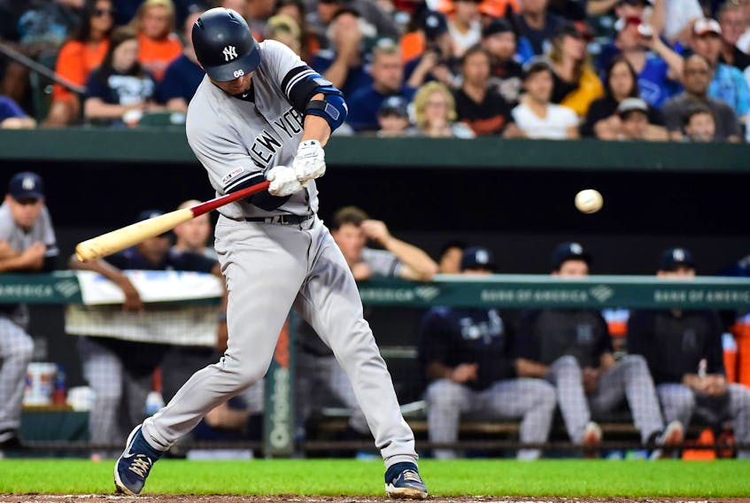 
New York Yankees catcher Kyle Higashioka (66) hits a home run in the fourth inning against the Baltimore Orioles at Oriole Park at Camden Yards in Baltimore on Wednesday, Aug. 7, 2019. - Evan Habeeb / USA TODAY Sports
