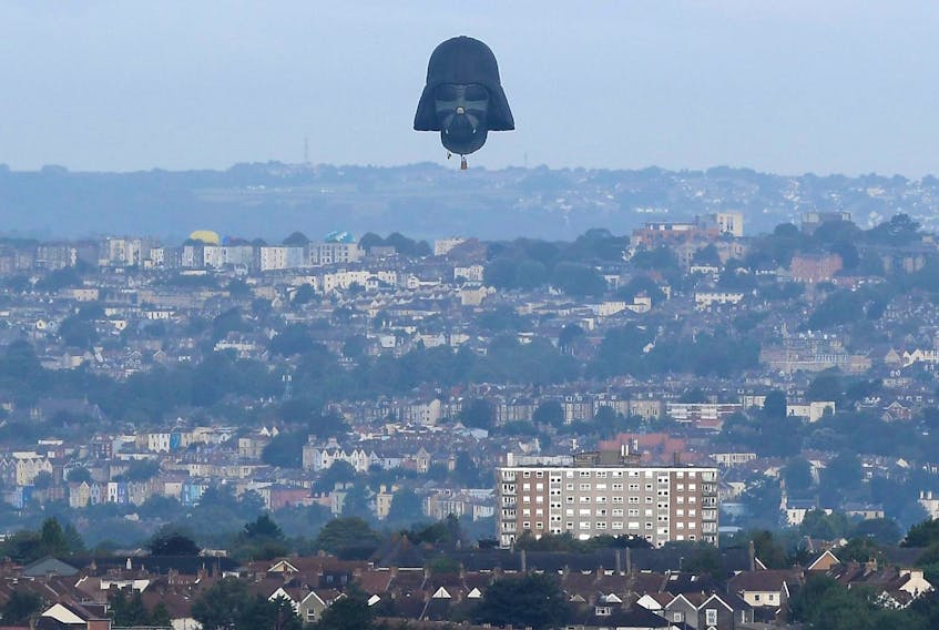 
A balloon shaped as the head of Star Wars film character Darth Vader flies at the annual Bristol hot air balloon festival in Bristol, Britain, August 8, 2019. - Toby Melville / Reuters
