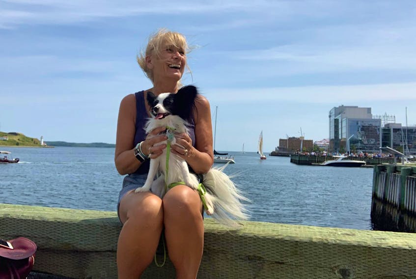 
Carol Craig and Eddie, her emotional support dog, share a seat on the Halifax waterfront on Aug. 3. Craig was recently told she wasn’t allowed to bring Eddie to Halifax Citadel National Historic Site. - Nancy Wendel
