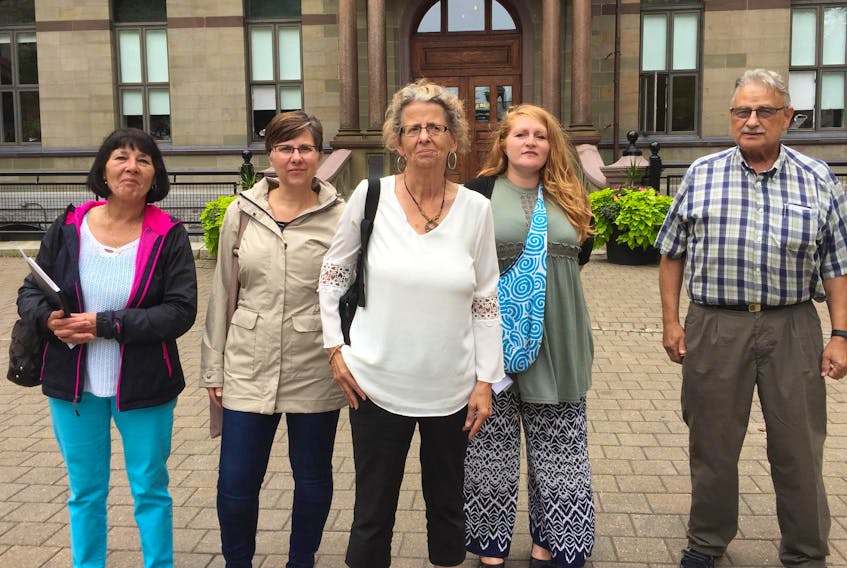 
From left, Nancy Nicholson, Jeannette Brown, Marlene Brown, Angela Zwicker and Wayne Rhyno stand outside Halifax City Hall on Friday. The Harrietsfield residents were presented with a proposal that may bring municipal water service to part of their community if a majority of residents agree to a plan that would see them pay more than $27,000 per lot for the expansion. - Stuart Peddle
