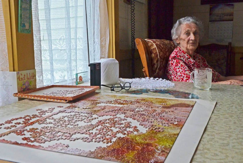 Jessie Tompkins, 94, lives alone down a long dirt road on the farm where she raised nine children.