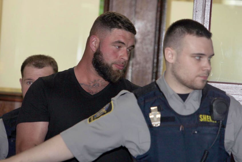 
Chris Allen Sampson, a bouncer at Reflections Cabaret in downtown Halifax, is shown after appearing in court in May on charges of aggravated assault and breaching a recognizance. - Eric Wynne
