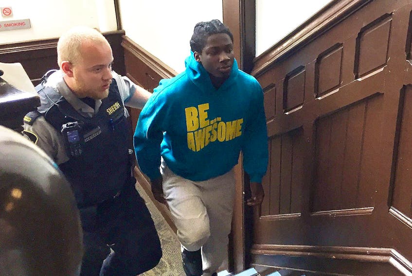 
Jayree Vontaze Downey is led into provincial court Friday for arraignment on nine charges, including attempted murder, from an Aug. 9 shooting in the Spring Garden Road area of downtown Halifax. - Steve Bruce
