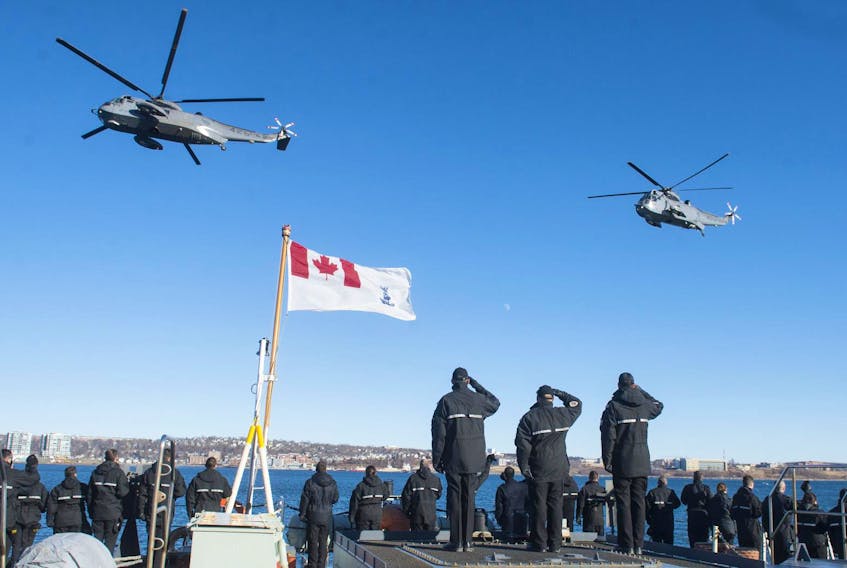 Three Sea King helicopters fly past HMCS Moncton on the final flight for the East Coast Sea King fleet in January 2018. A B.C. company has bought 12 of the choppers.