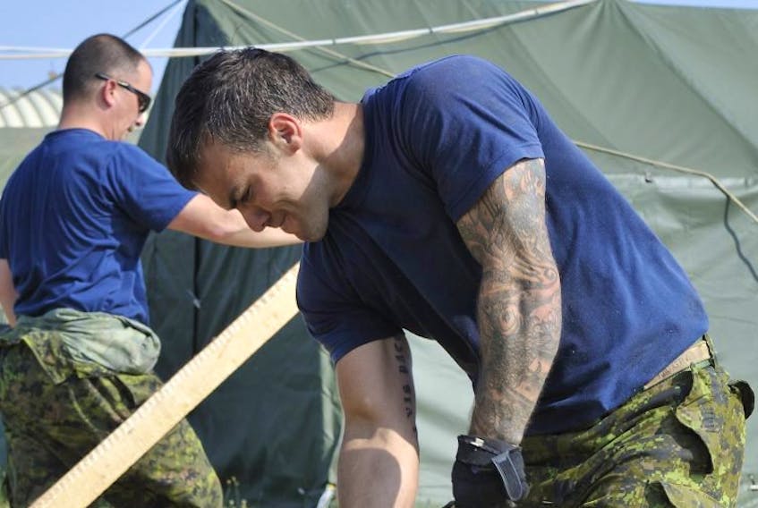 
A new Canadian Armed Forces’ policy states that tattoos are now only prohibited on the face and the scalp. Members can request an accommodation if they have, or intend to have, cultural or religious-based tattoos on the face and scalp. CPL. JEAN ARCHAMBAULT
