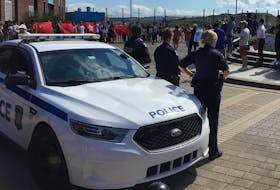 
Halifax Regional Police officers maintain an obvious presence Saturday as pro-China and pro-democracy groups gather at the waterfront. Tim Arsenault - The Chronicle Herald
