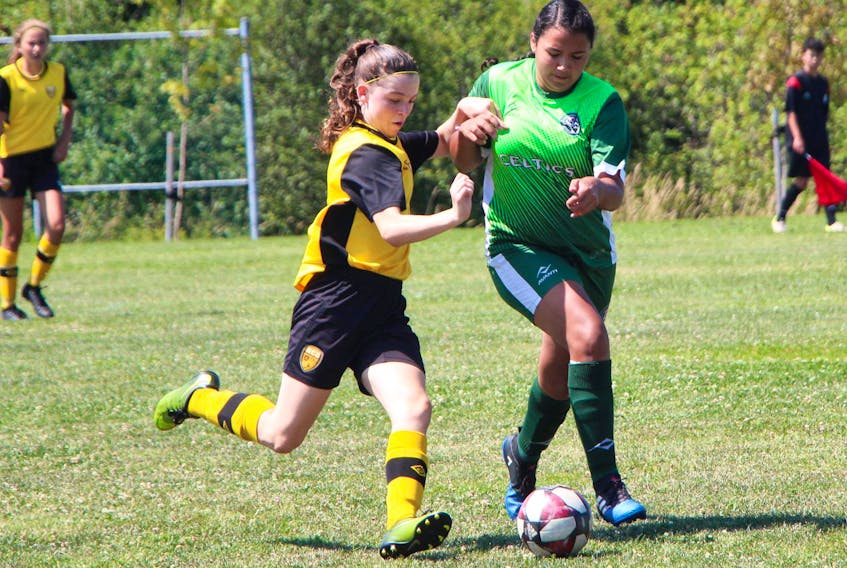
Antigonish U-15 Celtics player Aisling Boyd looks to slow up a County attacking player during Aug. 17 action on the field by Dr. J.H. Gillis Regional High School in Antigonish. Boyd scored in the 2-1 Celtics win. - Richard MacKenzie
