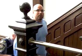
Brian James (B.J.) Marriott is escorted into Halifax provincial court Monday to face charges of breaching a recognizance and a peace bond. – Steve Bruce
