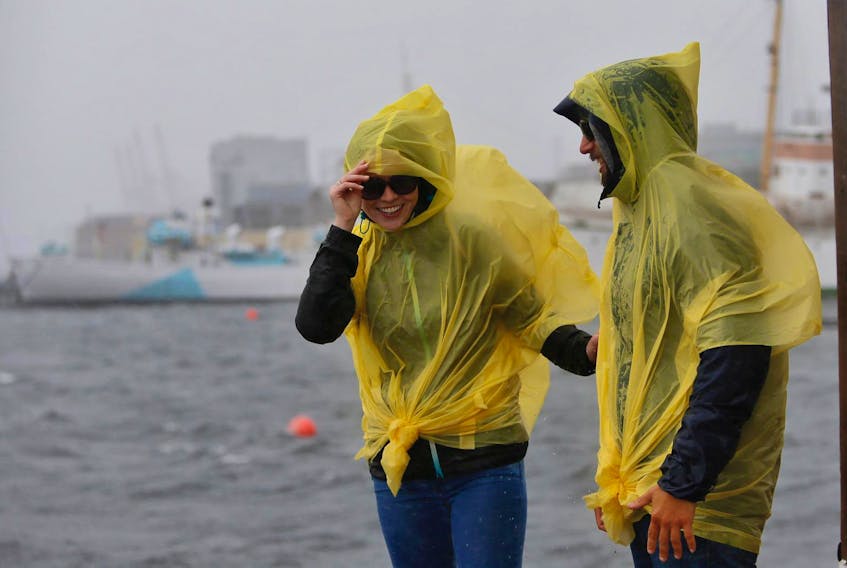 
Laura Martin and Adrien Lacrois check out the wind and rain on the Halifax waterfront on Saturday afternoon before Dorian’s arrival. - Tim Krochak
