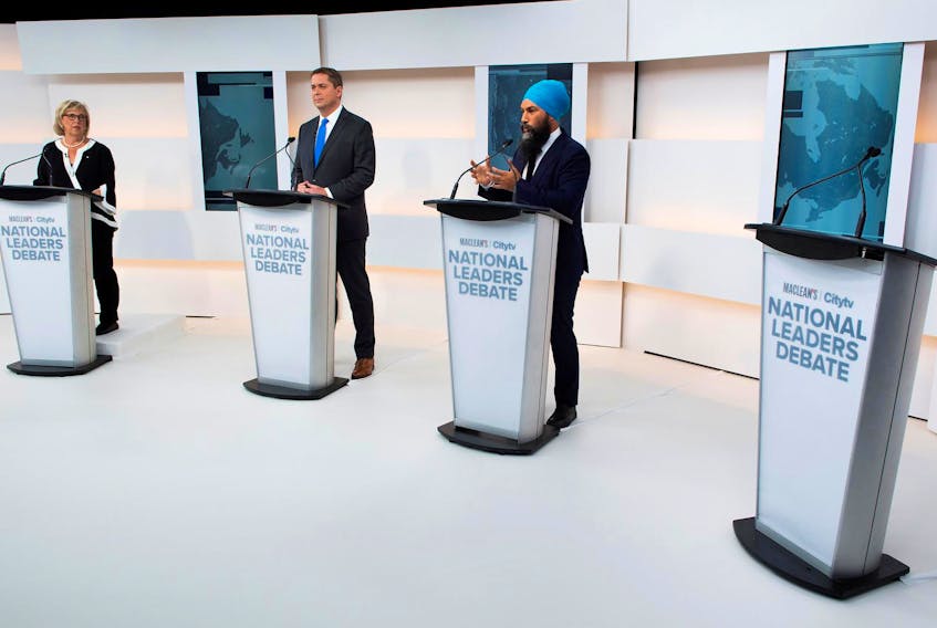 
Green Party Leader Elizabeth May, Conservative Leader Andrew Scheer and NDP Leader Jagmeet Singh take part in the Maclean's/Citytv leaders debate, alongside an empty place due to the non-appearance of Prime Minister Justin Trudeau, on the second day of the election campaign in Toronto on Sept. 12, 2019. - Frank Gunn / Pool via Reuters
