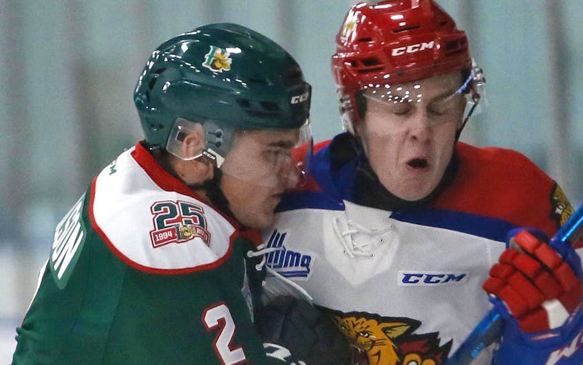 
Halifax Mooseheads defenceman Brendan Tomlinson, left, collides with Moncton Wildcats forward Mark Rumsey during QMJHL exhibition action at the Halifax Forum on Friday. (TIM KROCHAK/The Chronicle Herald)
