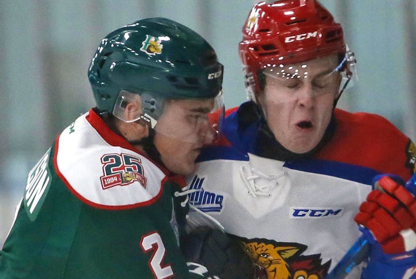 
Halifax Mooseheads defenceman Brendan Tomlinson, left, collides with Moncton Wildcats forward Mark Rumsey during QMJHL exhibition action at the Halifax Forum on Friday. (TIM KROCHAK/The Chronicle Herald)
