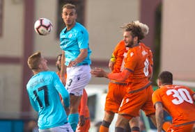 HFX Wanderers striker Tomasz Skublak and centre-back Matthew Arnone vie for the ball with a quartet of Forge FC players during Wednesday night’s Canadian Premier League match at the Wanderers Grounds.