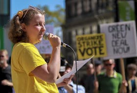 
Willa Fisher, teenage climate change activist, speaks to a gathering at a rally against climate change in the Grand Parade in Halifax Friday. TIM KROCHAK / The Chronicle Herald

