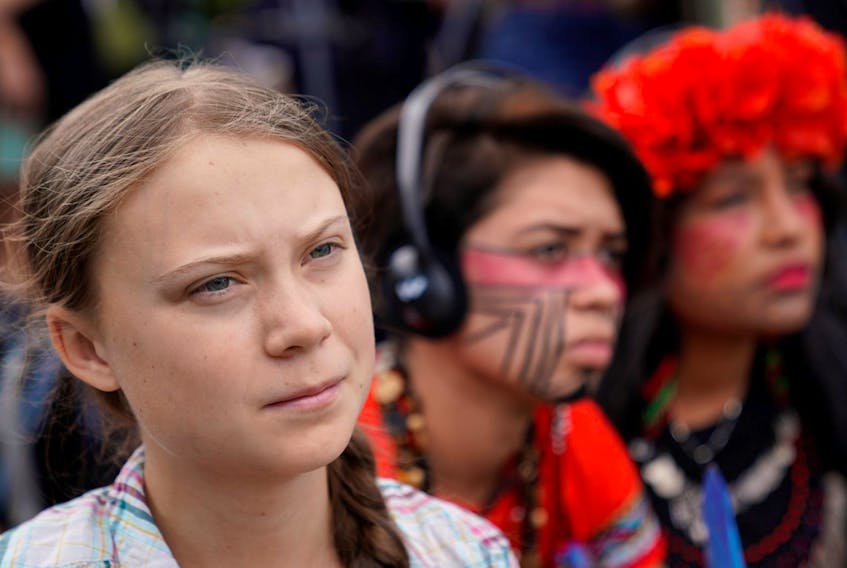 Sixteen-year-old Swedish climate activist Greta Thunberg listens to speakers during a climate change demonstration at the U.S. Supreme Court in Washington, D.C., on Sept. 18.