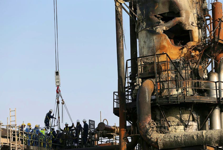 
Workers check out the damaged site of the Saudi Aramco oil facility in Abqaiq, Saudi Arabia, Sept. 20, 2019. Hamad l Mohammed / Reuters
