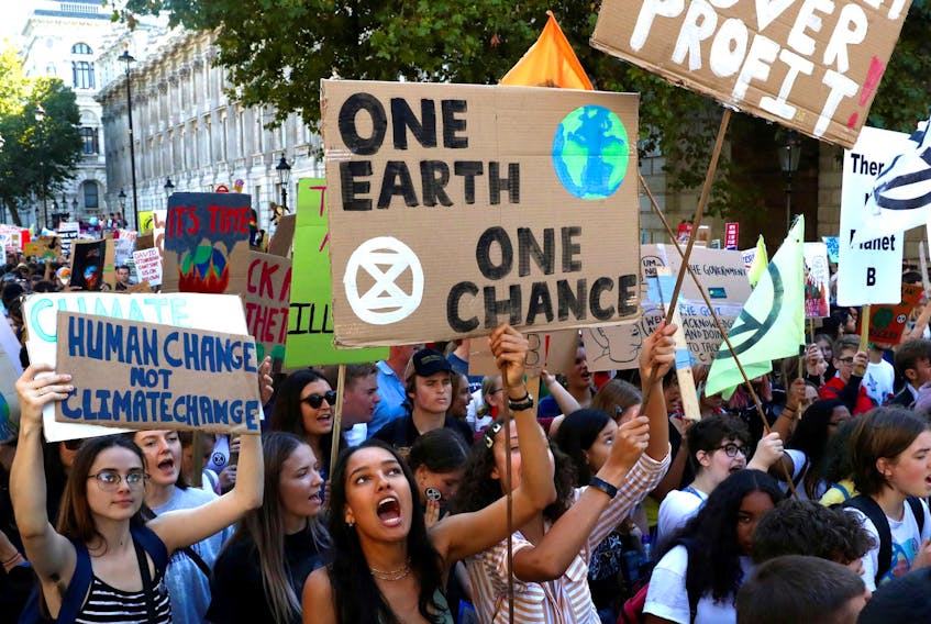 
People attend a climate change demonstration in London. - Simon Dawson / Reuters
