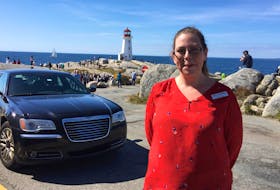 
Brittany Saunders, a staffer at the Sou’ Wester restaurant and gift shop in Peggys Cove, says vandals have been chipping away at the foundation of the iconic lighthouse and defacing the windows with stickers. - STUART PEDDLE
