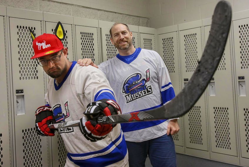 
Halifax Mussels players Tristan Laan (left) and Chuck Dauphinee, the team founder, in a dressing room in Halifax. The team was created with the aim to provide a safe space to all LGBTQ+ hockey players and allies. TIM KROCHAK/ The Chronicle Herald
