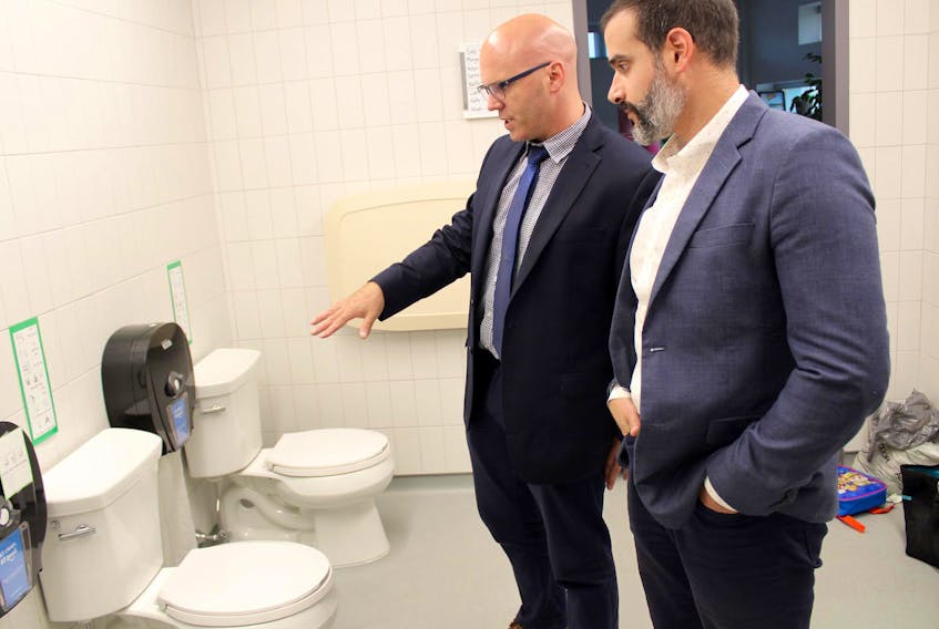 Chris Boulter, regional executive director with the Tri-County Regional Centre for Education, and Zach Churchill, Nova Scotia’s minister of education and early childhood development, look over the washroom facilities in the pre-primary section of Yarmouth Elementary School. The lack of privacy barriers will be addressed, Churchill said.