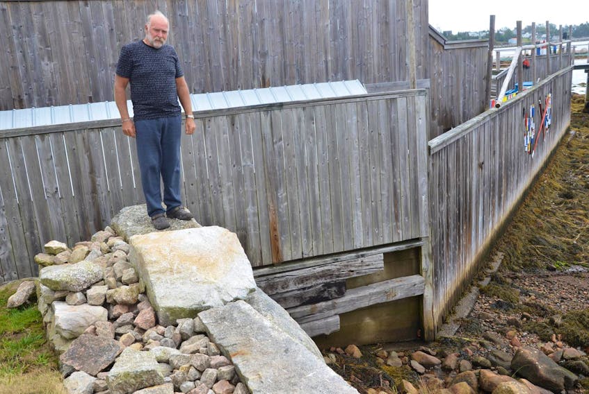 Alan Dempsey of Ketch Harbour says he was initially denied a permit to extend his seawall by about eight feet while others in the area were given the go-ahead.