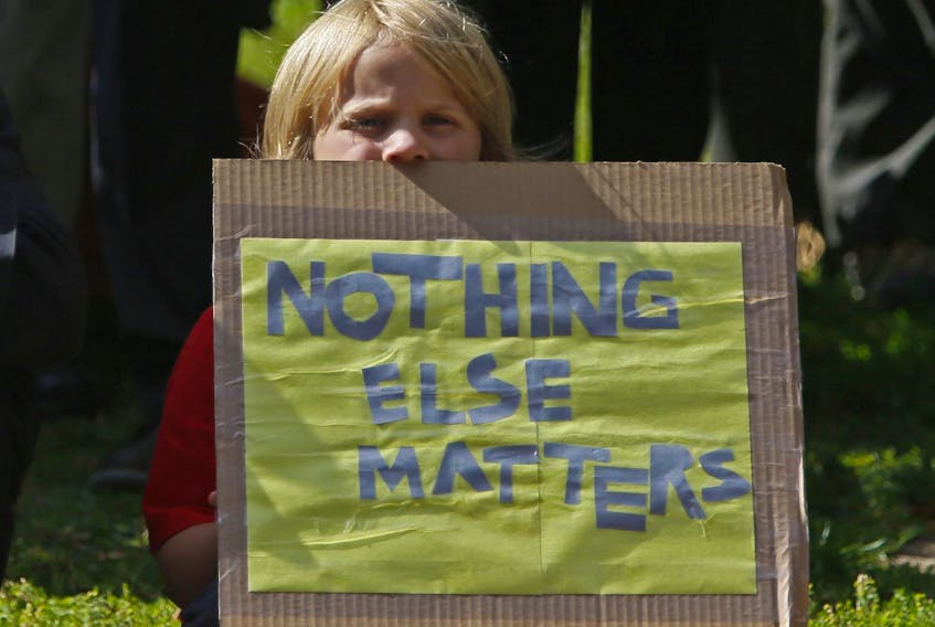 
A young protester holds a placard during the rally against climate change in the Grand Parade in Halifax on Friday, Sept. 20, 2019. - Tim Krochak
