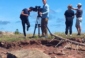 Members of a BBC film crew set up a camera overlooking some of the remnants of the Chignecto Marine Ship Railway in Fort Lawrence. The BBC is featuring the ship railway in a future episode of Great American Railway Journeys.