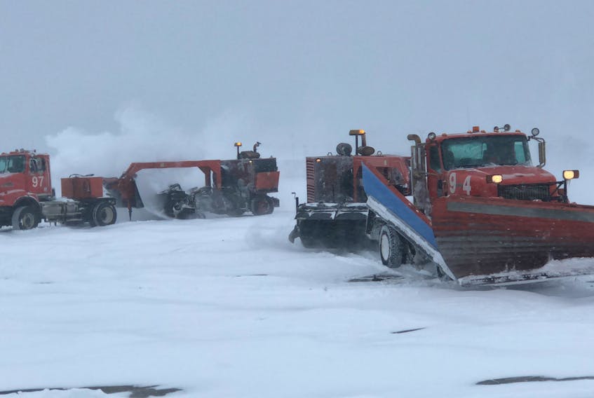 Sweeper trucks are used at the Gander Airport to clear snow from the runways and taxiways. A brush is located at the rear of the machine to clear debris, in addition to a blower that pushes snow away.