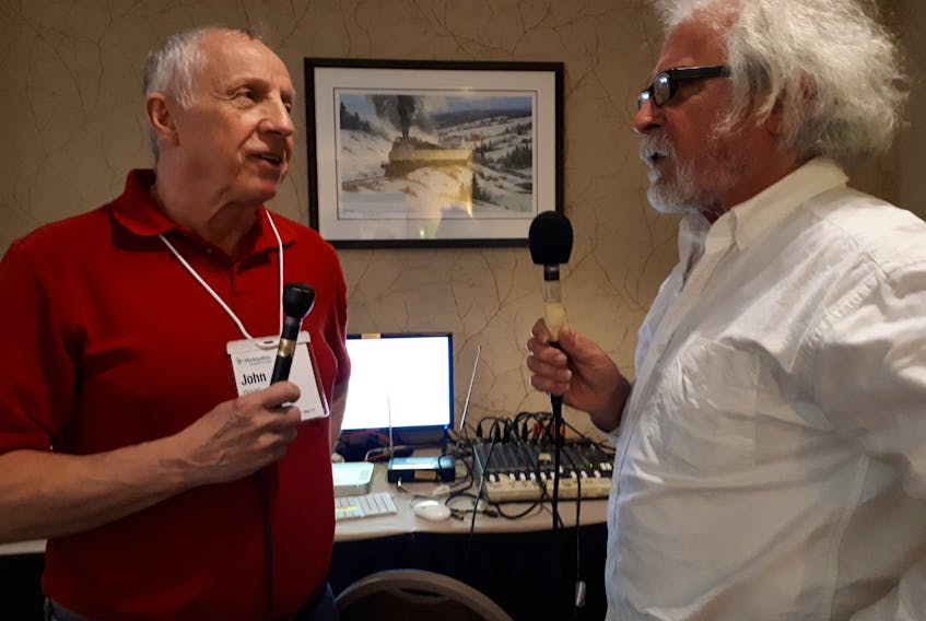 Clarenville councillor John Pickett, left, said his community spends upwards of $50,000 per year to monitor its wastewater output. He would like to see the three levels of government reach a funding agreement that would allow municipalities to move forward with sewage treatment upgrades. Picket is pictured speaking with MNL Radio host Fred Campbell.