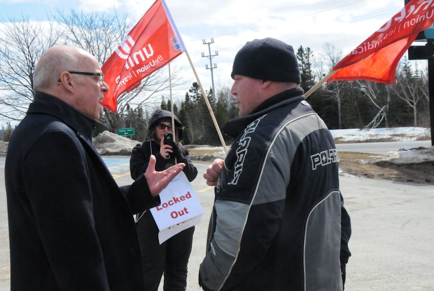 Gander MHA John Haggie speaks with Ignatius Oram, one of the locked-out employees at D-J Composites in Gander. The employees have been locked out for approximately 16 months and are calling on provincial government to implement binding arbitration.