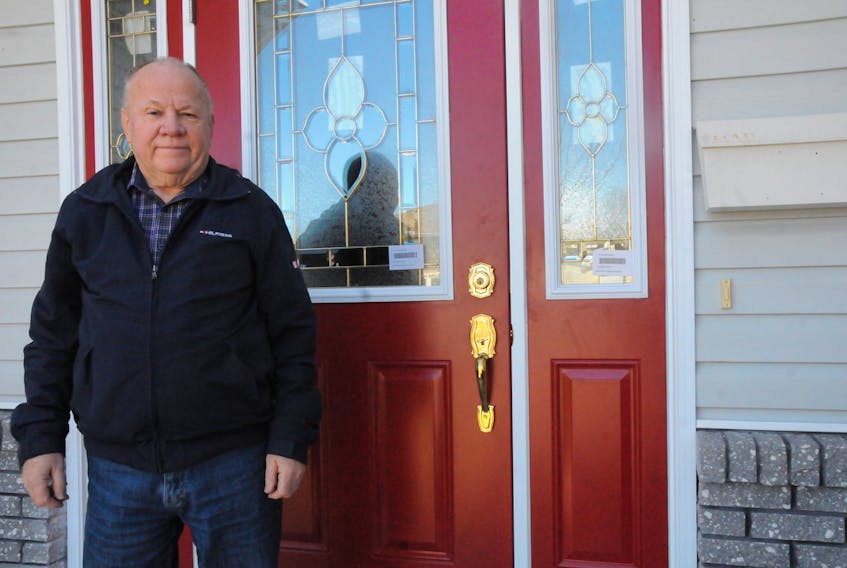 Gander resident Heber Bowering was the victim of break and enter earlier this year that caused more than $13,000 in damages to his property. Standing next to one of three doors that had to be replaced, he is calling on the RCMP and area politicians to bring about a stronger police presence.