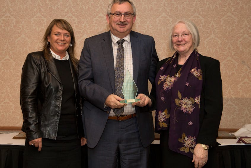 Rex Avery, general manager of Steele Hotels accepted the Joe and Clarice Goodyear award on behalf of Steele Hotels. Clarice Goodyear, left, presented the award with Chamber chair Debby Yannakidis.