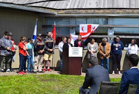 Pictou Landing First Nation Chief Andrea Paul speaking after the federal government announces $100 million investment in Boat Harbour remediation with her council and community beside her.