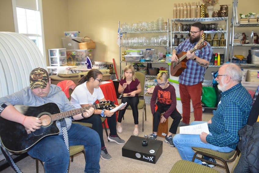 Fergus O'Byrne offers pointers to The Newfoundland Gang during the Young Folk at the Hall event in Marystown. From left, are Justin Barnes, Abbey Fiander, Emma Fiander, Simon Pittman, Mentor Colin Pittman and O'Byrne.