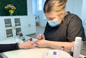 Emma Myers of the Antigonish Nail Boutique and Spa works on a customer’s nails.