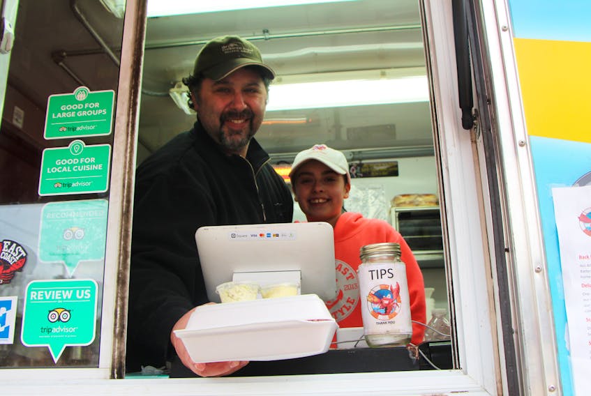Damian Welsh with daughter Kheiran handing out one of Back East Seafood’s specialties – a two-piece fish and chips.