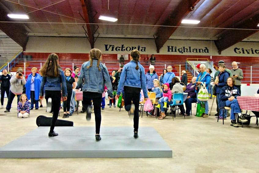 Members of TAPS - Totally Awesome People Stepping, a local step dance group, are shown performing July 24, 2019 at the Baddeck Farmers Market. Photo by Simone Carmichael