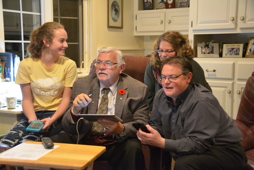 Newly elected Summerside Mayor Basil Stewart watches election results roll in with his family on Monday, Nov. 5, 2018.